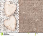 burlap background with white lacy cloth and wooden hearts dxxh2a clipart